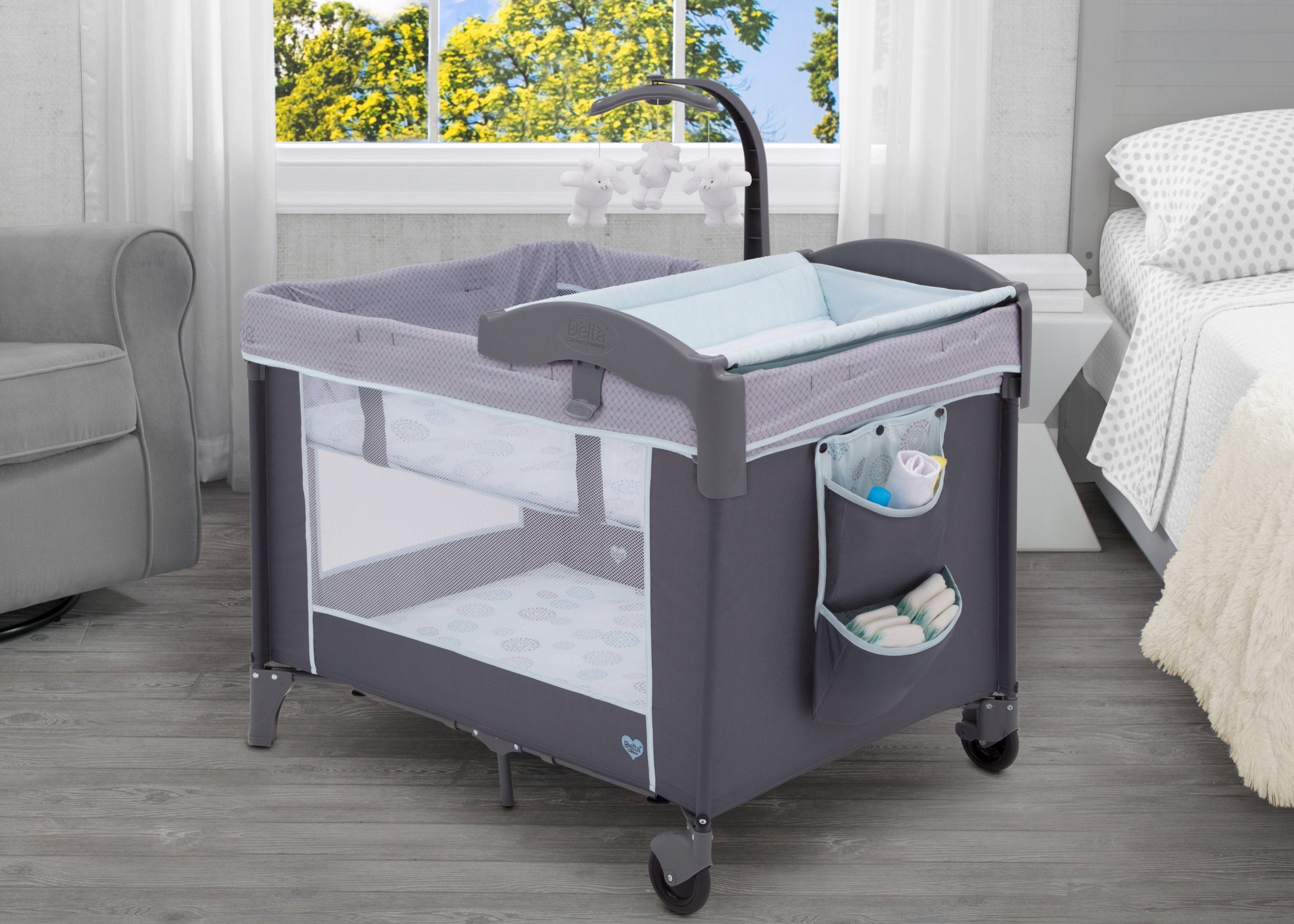 Playpen with changing outlet table and bassinet