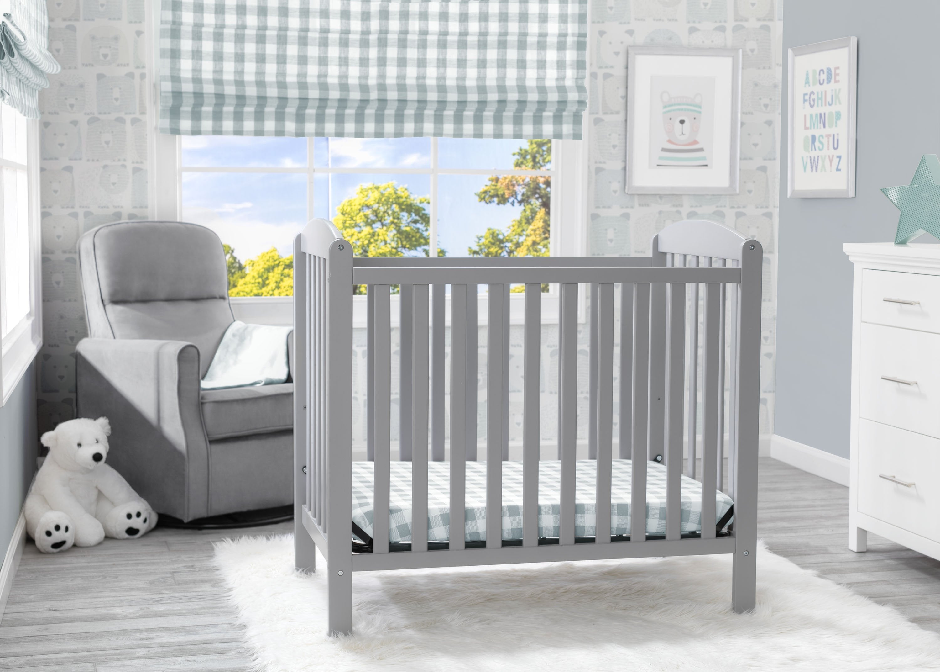 Mini crib with 2024 drawers
