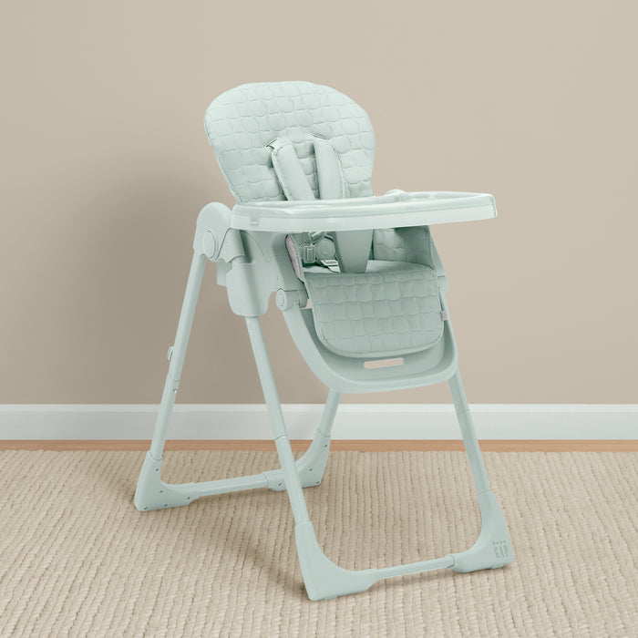 Light gray high chair on a beige carpet with a beige wall background 2-babyGap Classic 3-in-1 Convertible High Chair for Babies & Toddlers