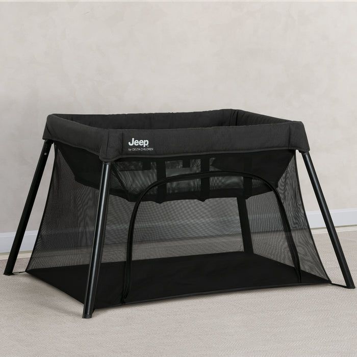 Black Jeep travel cot on a light gray background 1-Horizon Compact Travel 2-in-1 Play Yard and Bassinet