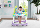Baby in a colorful baby walker in a room with toys and plants 28-Deluxe Bounceroo Learn2Walk Balancer Baby Walker