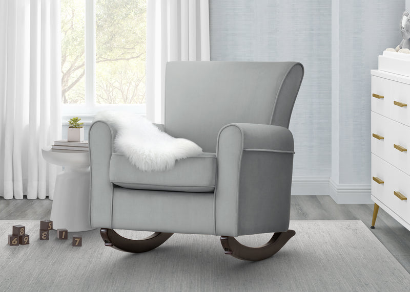 Gray rocking chair in a room with a dresser and window 21-Lancaster Rocking Chair featuring LiveSmart Fabric by Culp