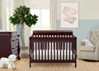 Nursery room with a wooden crib, dresser, and armchair. 39-Canton 4-in-1 Crib