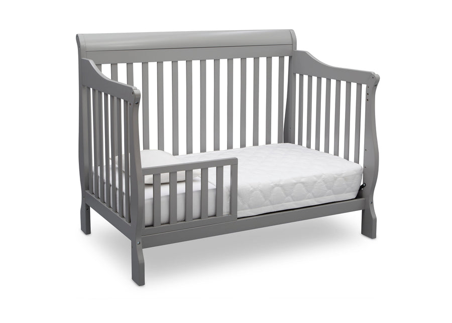 Gray crib with a white mattress on a white background 45-Canton 4-in-1 Crib
