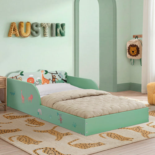 Children's room with a green bed featuring animal prints, a lion plush toy, and decorative letters spelling 'AUSTIN'.