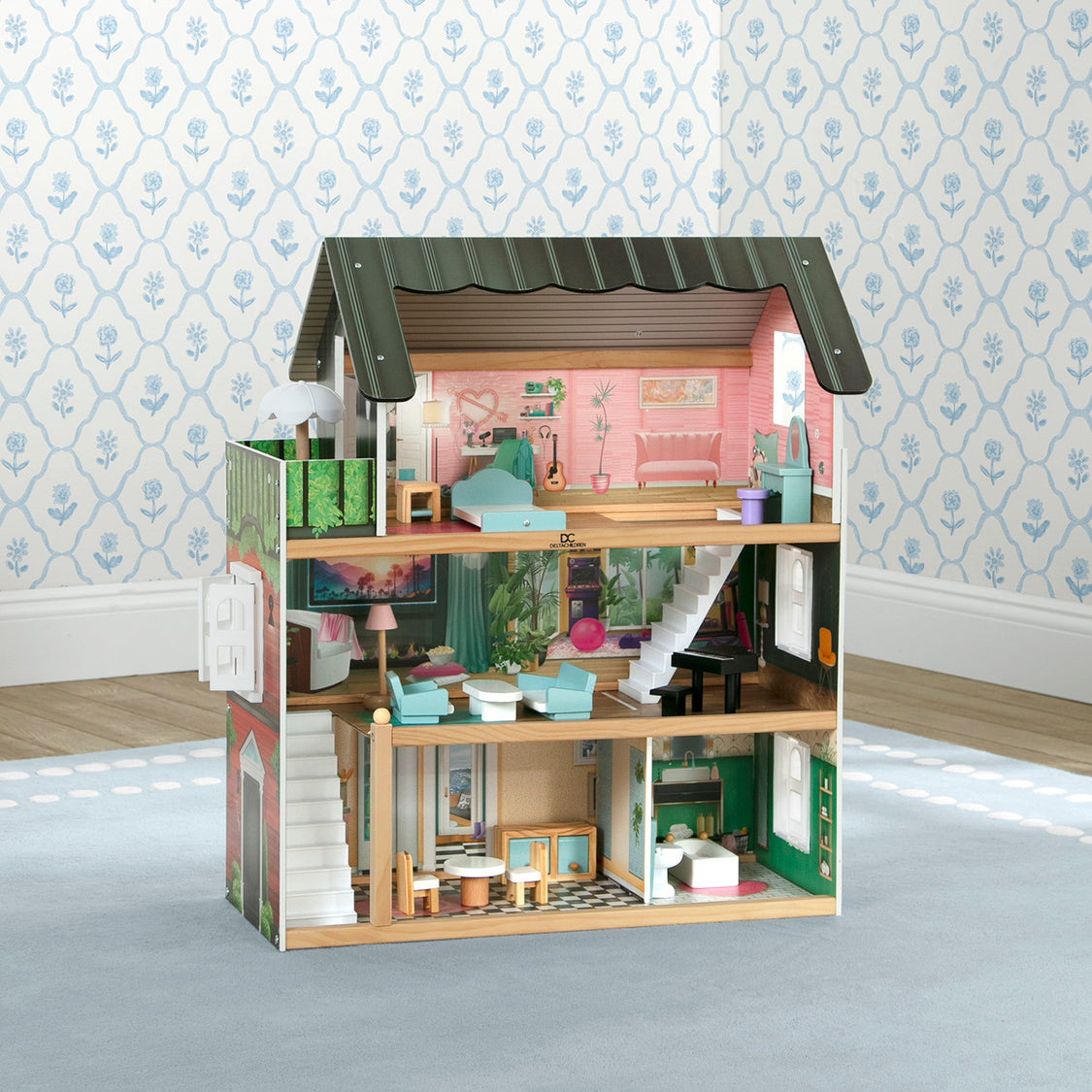 Wooden dollhouse with detailed interior on a neutral background