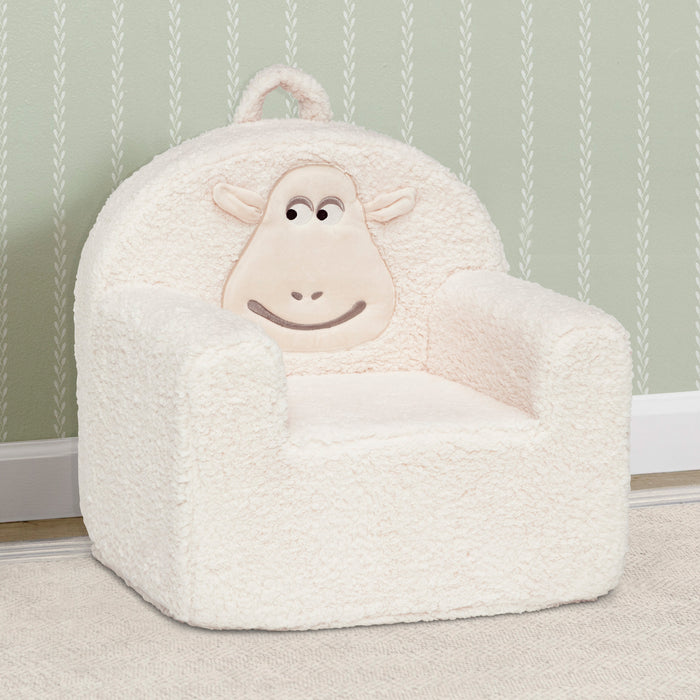 White sheep-shaped bean bag chair against a light green wall with subtle pattern. 2-Counting Sheep Kids Foam Chair