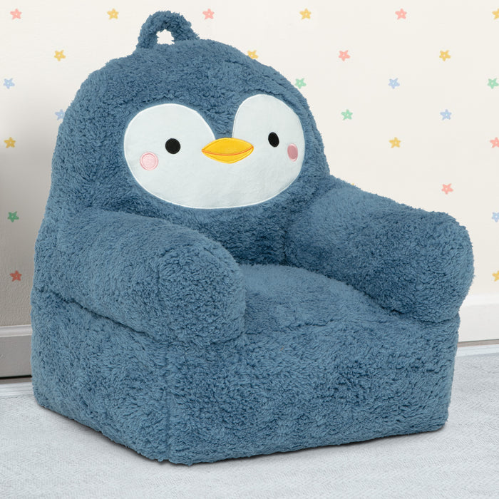 Blue penguin-shaped bean bag chair on a light gray floor with a star-patterned wall in the background. 1-Penguin Cozee Buddy Chair
