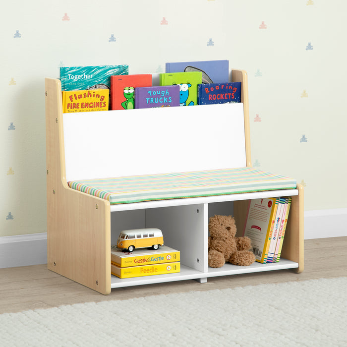 Children's bookshelf with books and toys against a light-colored wall. 1-GapKids Reading Nook with Padded Bench