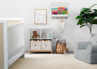 Nursery room with crib, bookshelf, and toys on a light wood floor. 40-Brannan Bear Bookcase with Bins