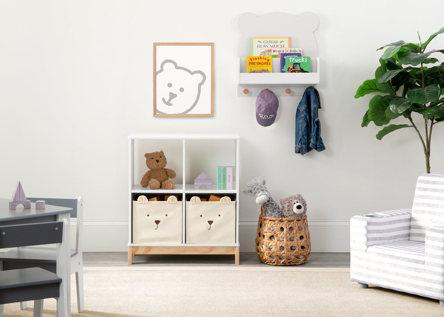 Children's room with storage unit, toys, and decor elements. 41-Brannan Bear Bookcase with Bins