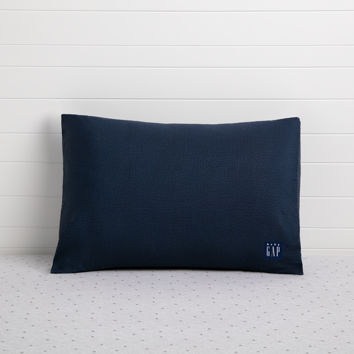 A navy-colored toddler pillow with a small logo on the bottom right corner, presented against a white background. 0-babyGap Memory Foam Toddler Pillow with 2 Cooling Covers