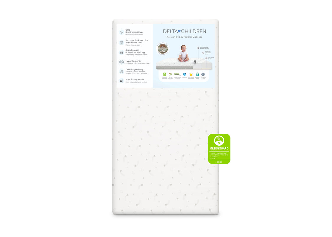 Delta Children crib mattress on a white background with a green label.