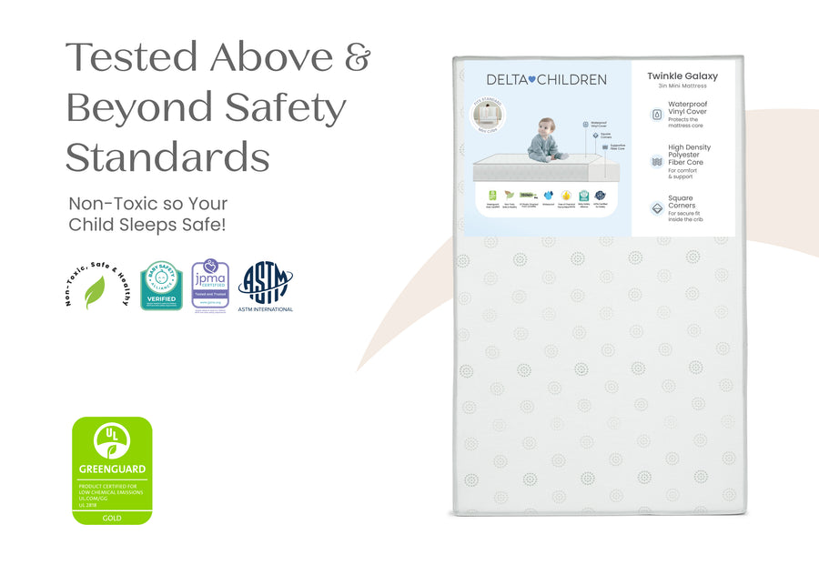 Delta Children mattress with safety certification logos on a white background 7-Twinkle Galaxy 3-inch Mini/Portable Crib Mattress