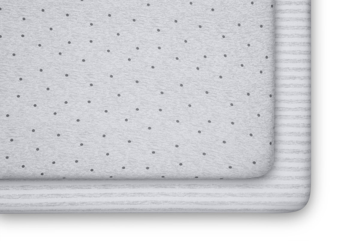 Gray bath mat with subtle pattern on a white background