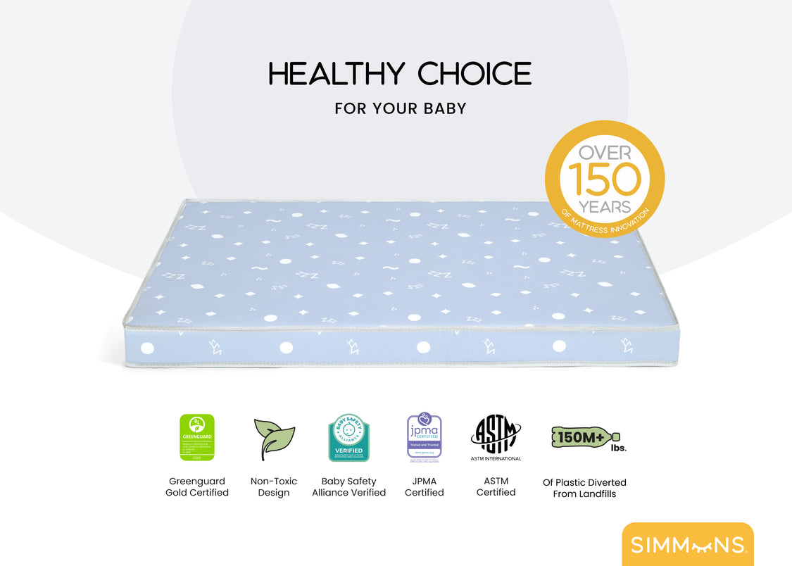 Baby mattress with certification logos on a white background