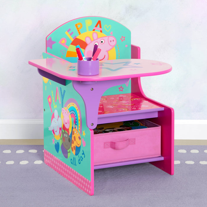 A pink chair and desk with storage bin, featuring colorful graphics of Peppa Pig and her friends. 3-Peppa Pig Big Adventures Chair Desk with Storage Bin