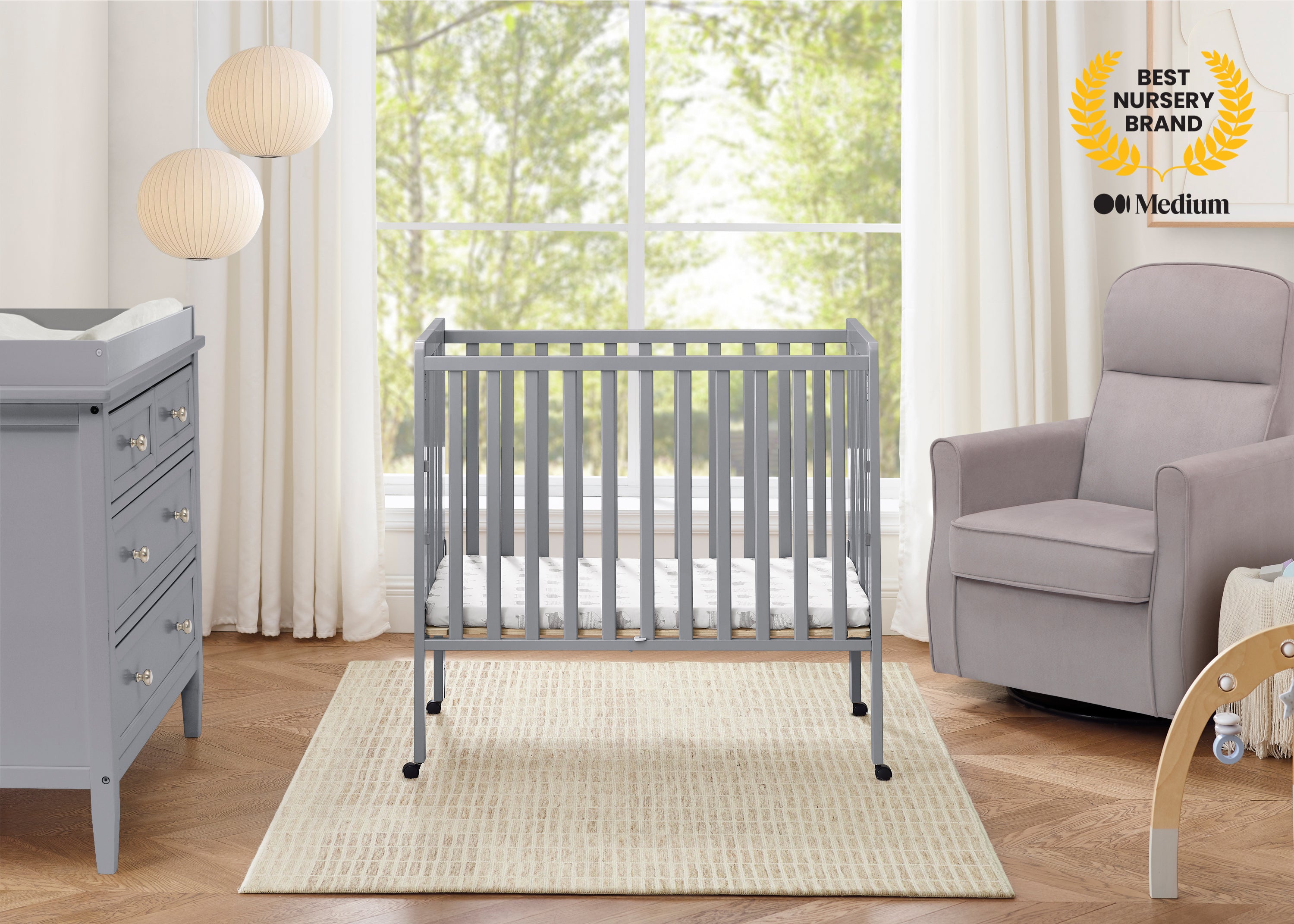 Lee Portable Folding Mini Crib with 1.5-Inch Mattress | Delta Children