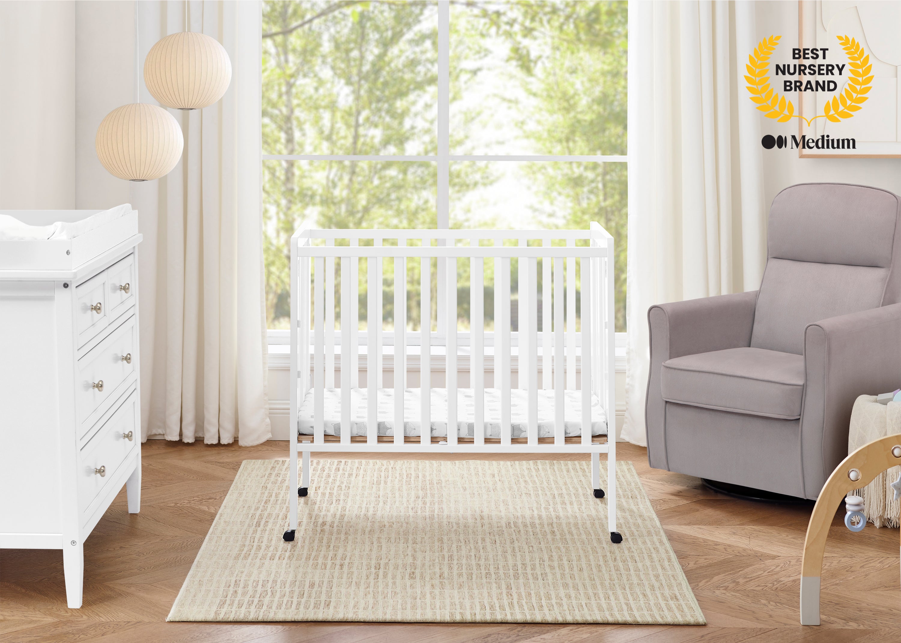 Lee Portable Folding Mini Crib with 1.5-Inch Mattress | Delta Children