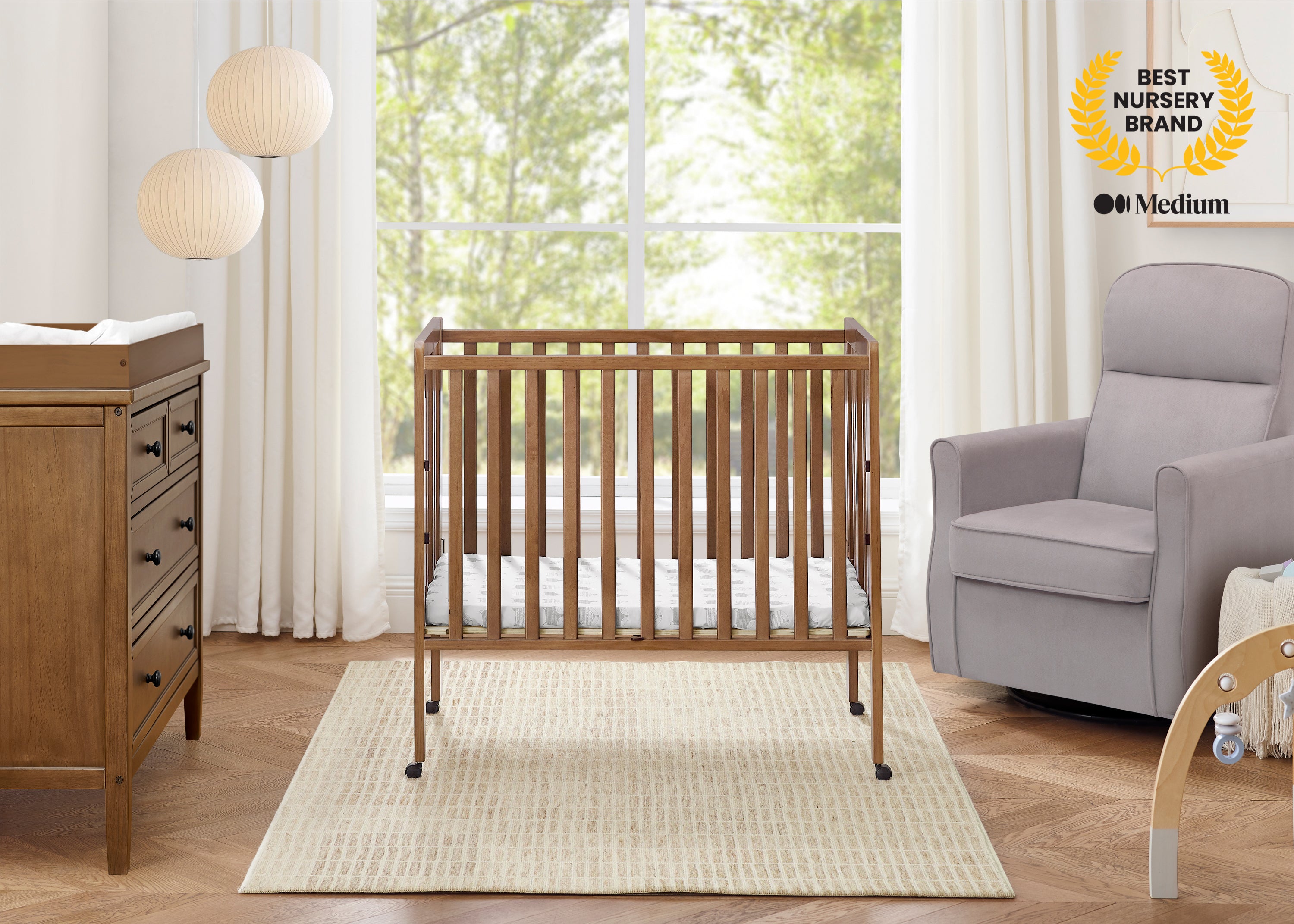 Lee Portable Folding Mini Crib with 1.5-Inch Mattress | Delta Children