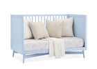 Light blue crib with white bedding and pillows on a white background 28-Dylan 4-in-1 Convertible Crib