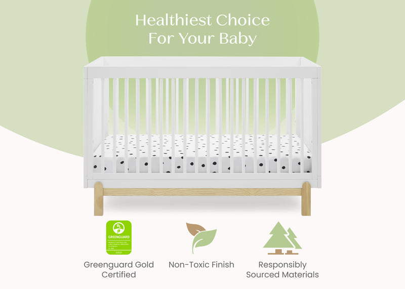 A white wooden baby crib with a white mattress featuring black polka dots, shown against a light green and white background with text reading 'Healthiest Choice For Your Baby' and certification badges below. 16-Poppy 4-in-1 Convertible Crib