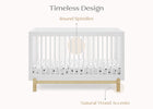White crib with natural wood accents on a white background 9-Poppy 4-in-1 Convertible Crib