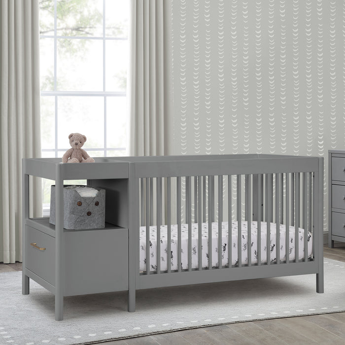 Gray crib with storage drawers in a nursery setting 1-Zoe 5-in-1 Convertible Crib and Changer