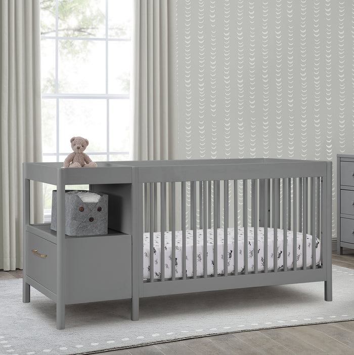 Gray crib with storage drawers in a nursery setting 1-Zoe 5-in-1 Convertible Crib and Changer