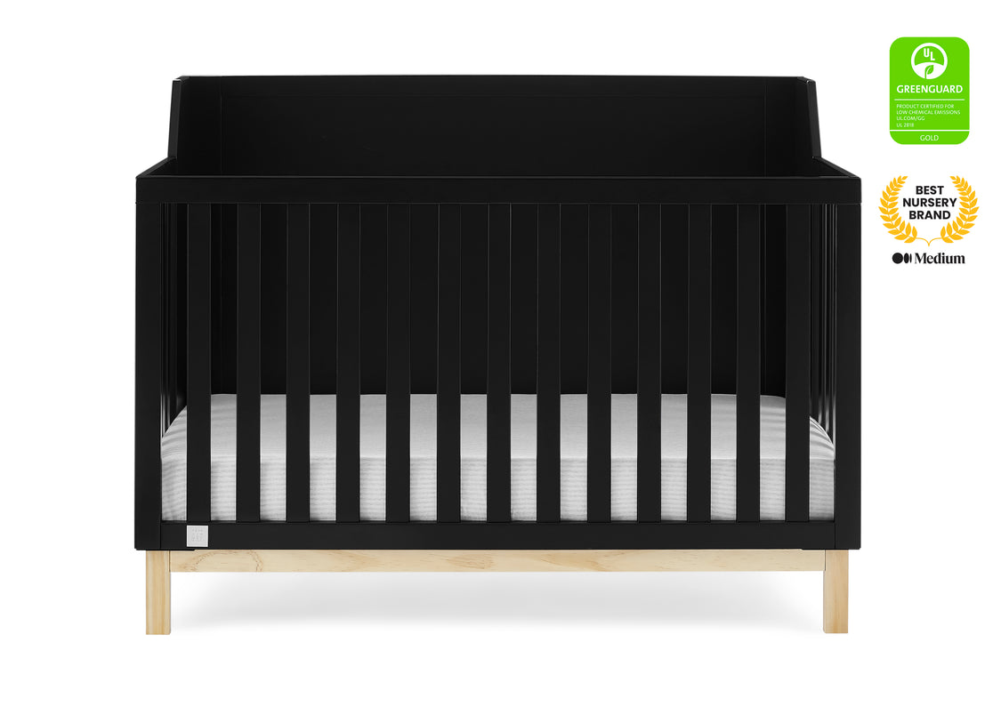 Black crib with a white mattress on a white background