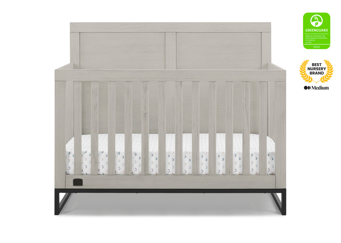 Gray crib with white mattress on a white background