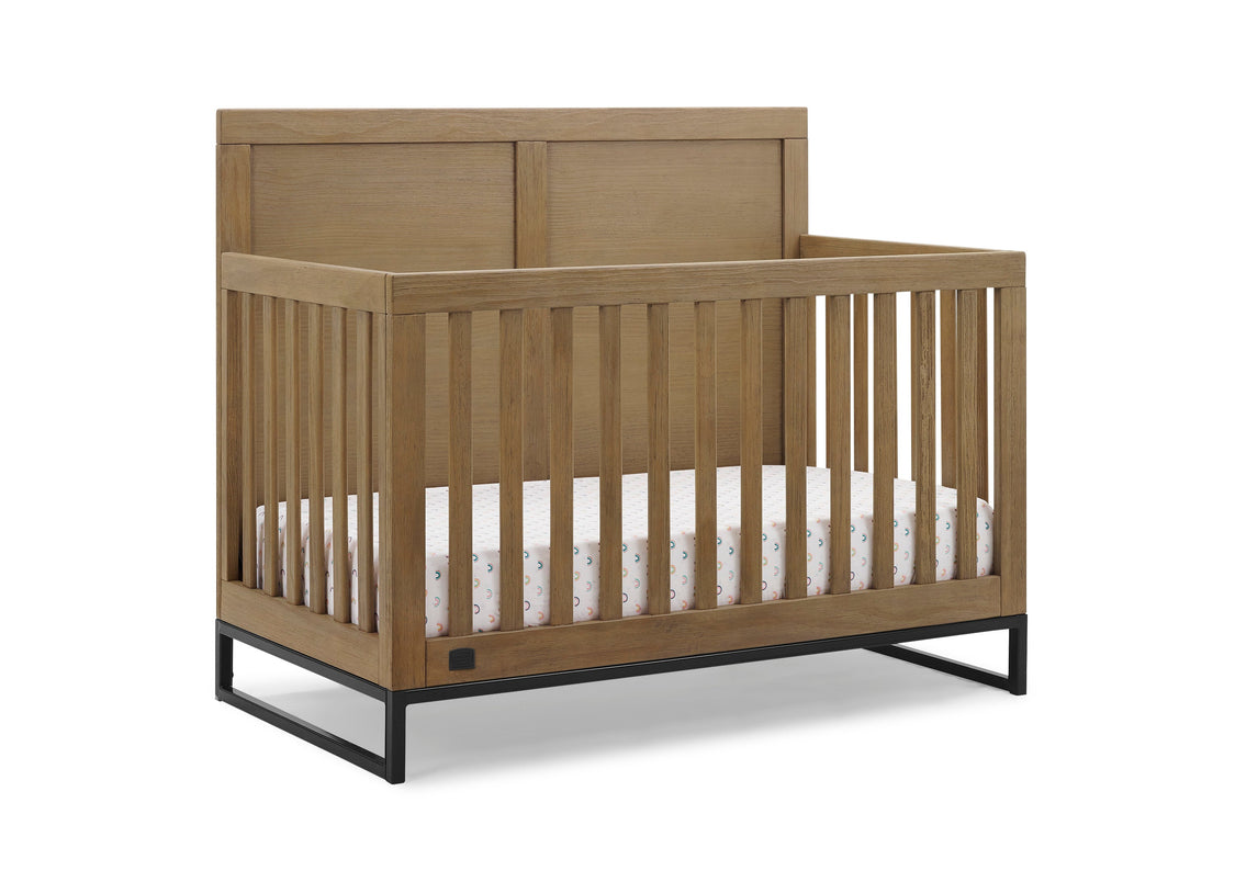 Wooden crib with white mattress on a white background