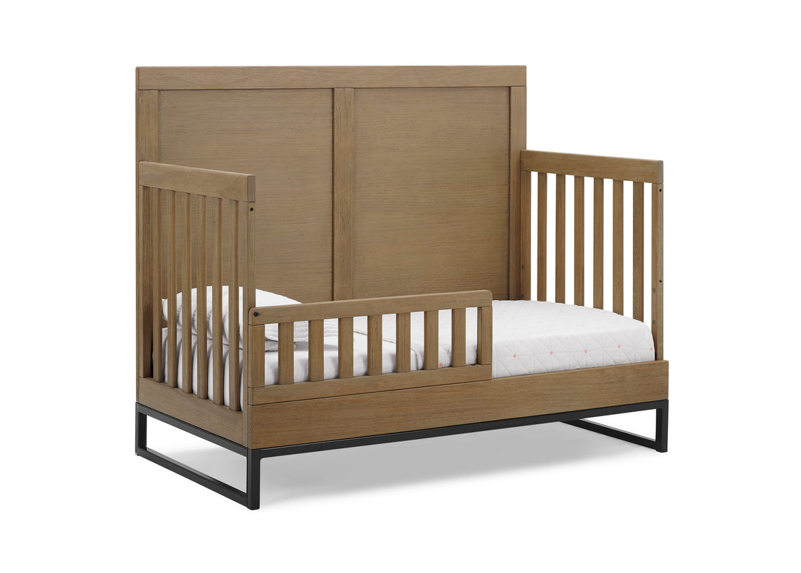 Wooden crib with white mattress on a white background