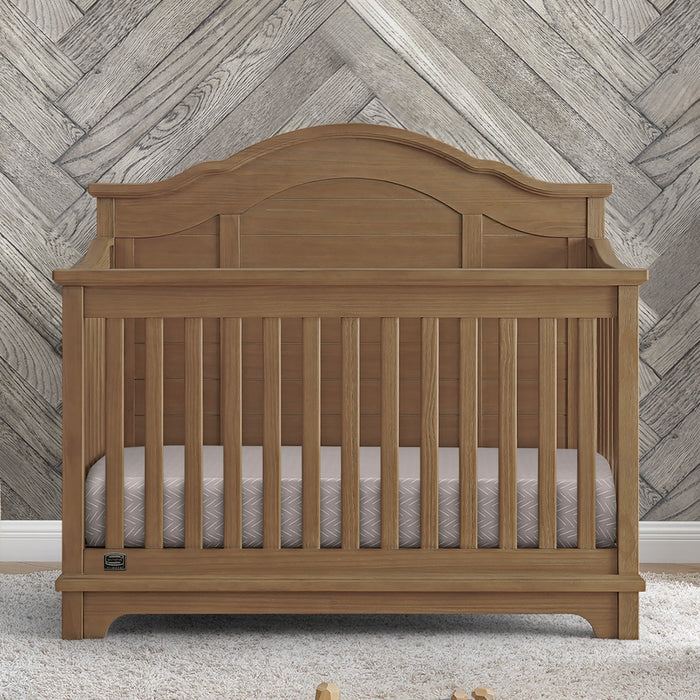 Wooden crib with a wooden wall background 1-Asher 6-in-1 Convertible Crib