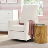 White armchair with a pink blanket next to a wooden side table in a room with pink walls and a window. 7-Andie Boucle Nursery Glider Swivel Chair