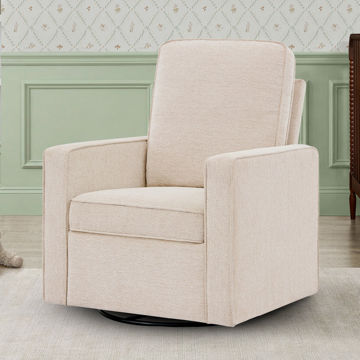 Beige swivel chair in a room with light green walls and patterned wallpaper. 1-Noah Upholstered Swivel Glider