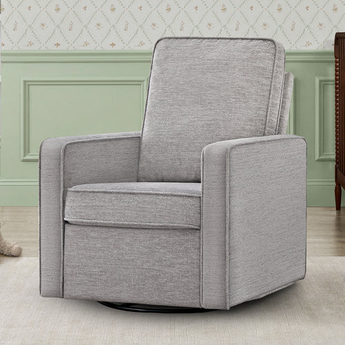 Gray upholstered armchair in a room with light green walls and a patterned wallpaper.