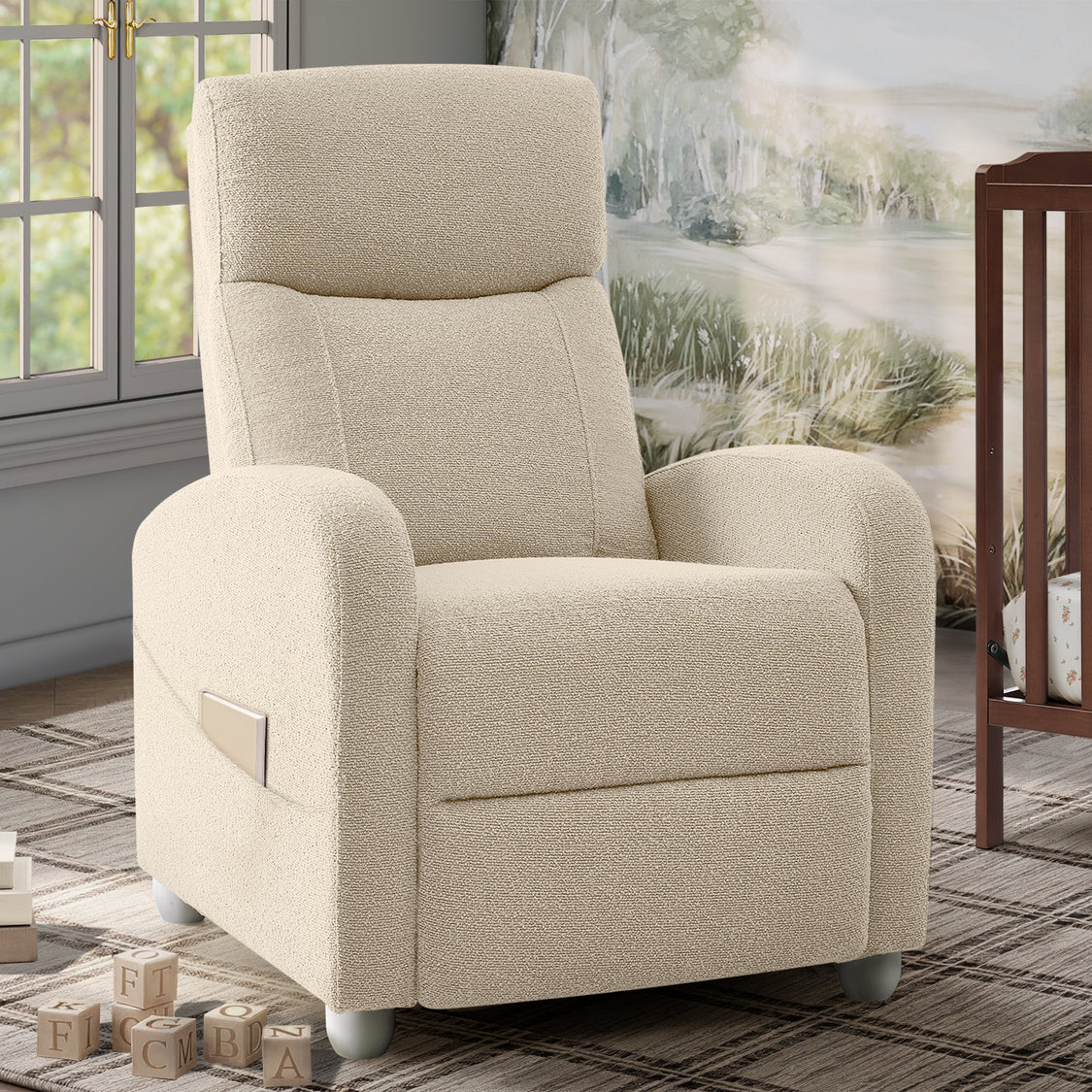 A cream-colored upholstered recliner chair with a side pocket, shown in a styled room setting with a window, rug, and wall art in the background.
