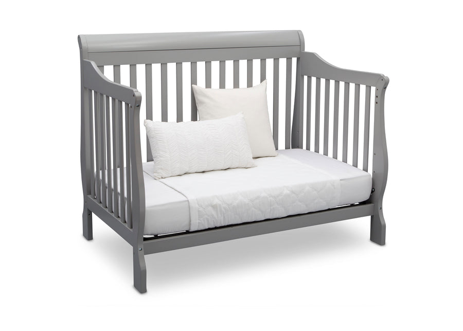 Gray crib with white mattress and pillows on a white background 46-Canton 4-in-1 Crib