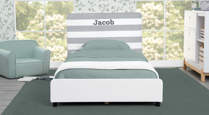 Bedroom with a bed named 'Jacob', green chair, and dresser. 3-Personalized Collection