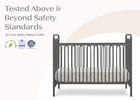 Gray crib with safety standards text and logos on a white background 16-Darcy 4-in-1 Convertible Metal Crib