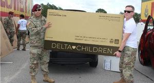 Soliders holding a Delta Children box 13