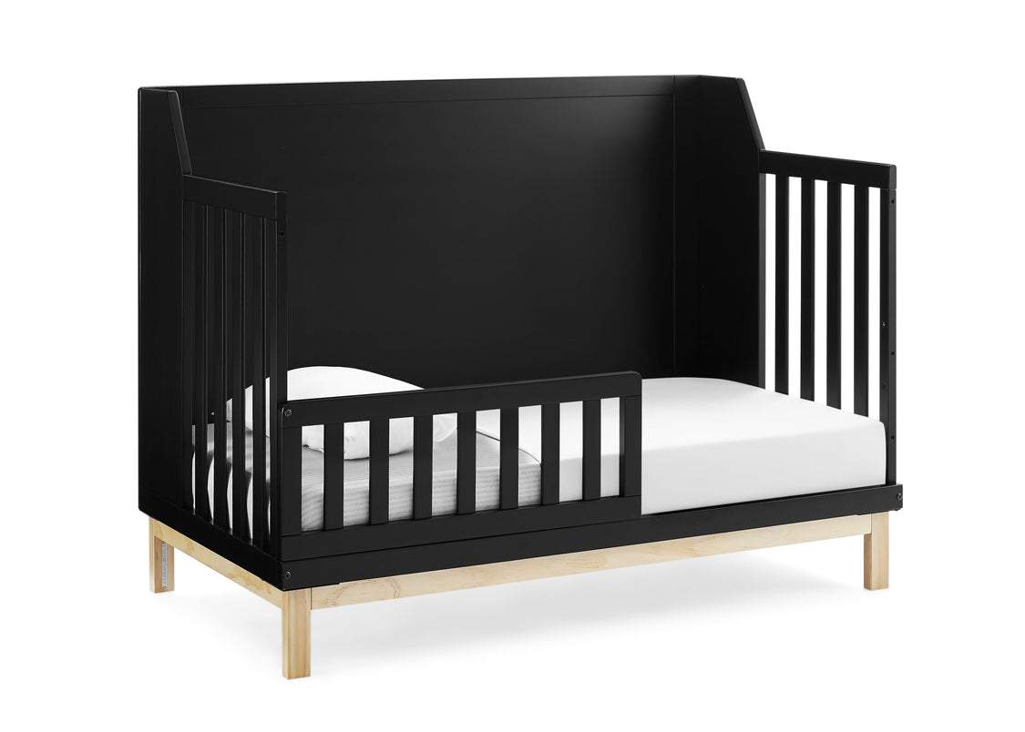 Black crib with white mattress on a white background