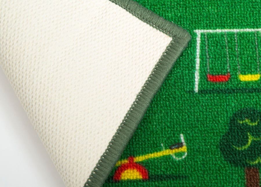 Close-up of a rug with a sports theme, featuring a field and sports equipment. 9-Large Road Map Activity Rug for Girls and Boys - 54-inch L x 39-inch W