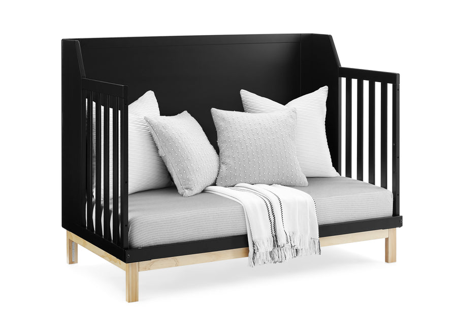 Black crib with white bedding and pillows on a white background 13-babyGap Oxford 6-in-1 Convertible Crib