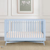 Light blue crib in a room with a framed picture on the wall. 29-Dylan 4-in-1 Convertible Crib