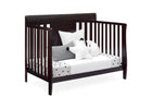Wooden crib with white bedding and decorative pillows on a white background 14-Richmond 6-in-1 Convertible Baby Crib