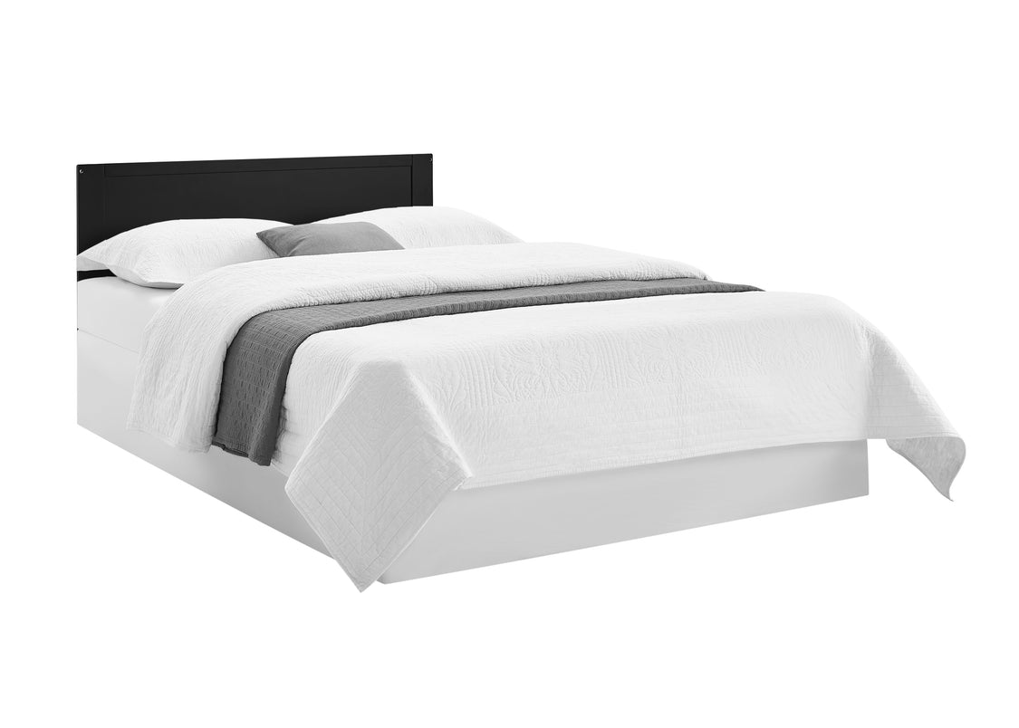Bed with white bedding and gray blanket on a white background