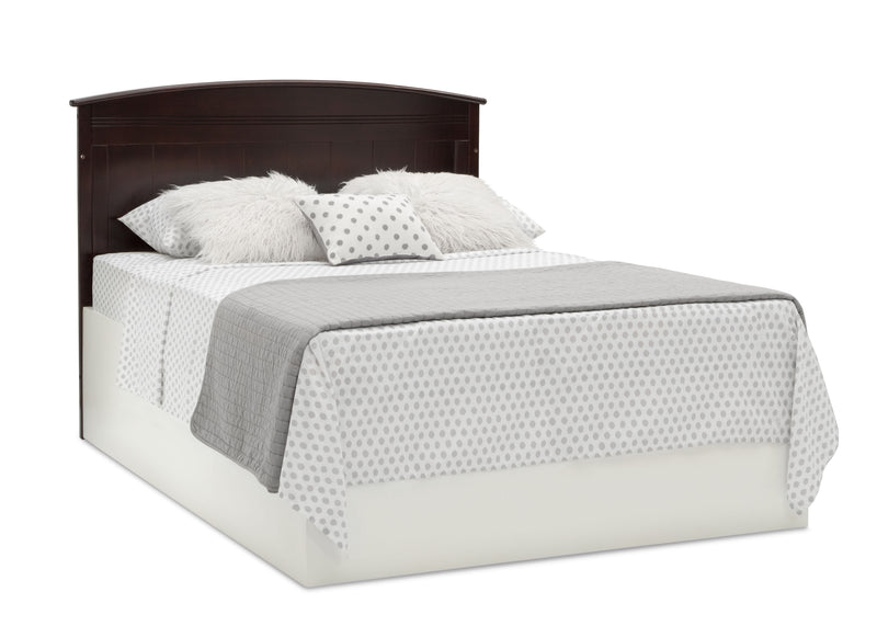 Bed with dark wooden headboard, gray bedding, and white mattress on a white background 21-Archer 4-in-1 Convertible Crib