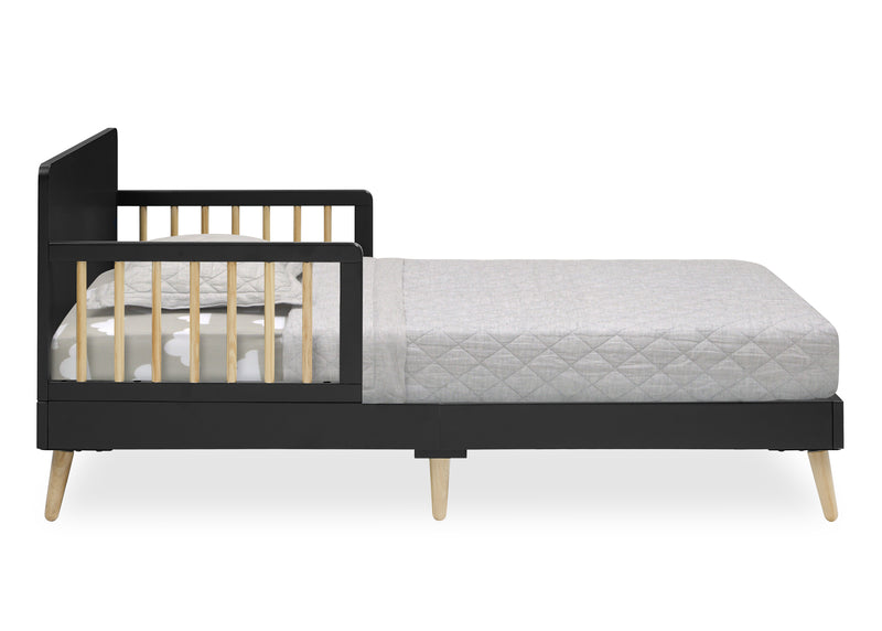 A modern toddler bed featuring a black frame, light natural wood slats on the guard rails, and tapered light wood legs, shown with a light gray quilted mattress on a white background. 6-Logan Wood Toddler Bed